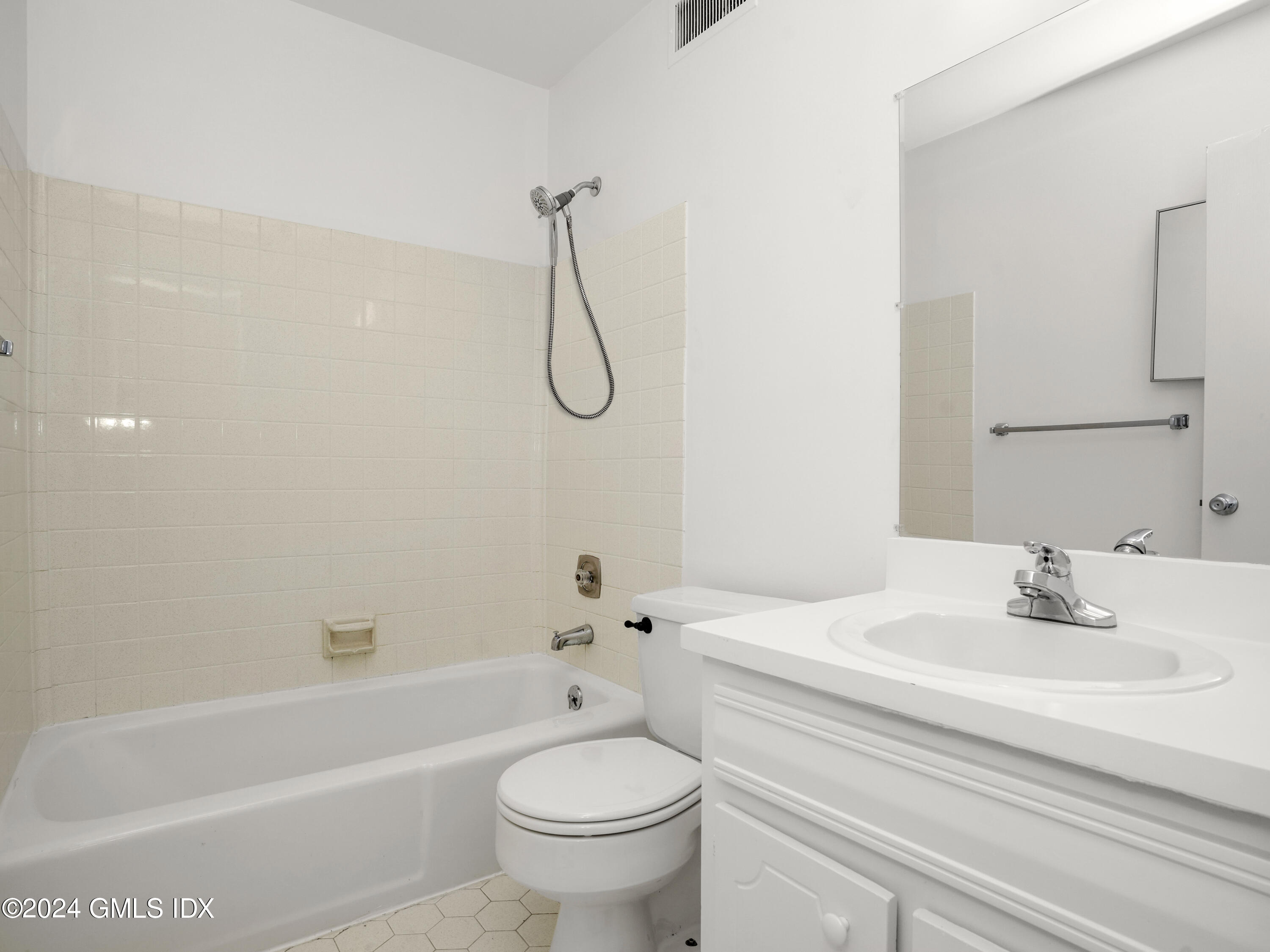413 Glenbrook Road, Unit 1 Stamford, CT 06906 - Photo 11 of 21 a bathroom with a sink a toilet and a bathtub