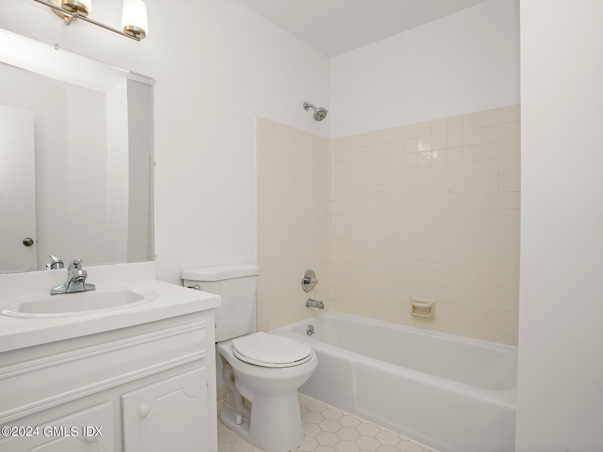 413 Glenbrook Road, Unit 1 Stamford, CT 06906 - Photo 14 of 21 a bathroom with a sink a toilet and bathtub