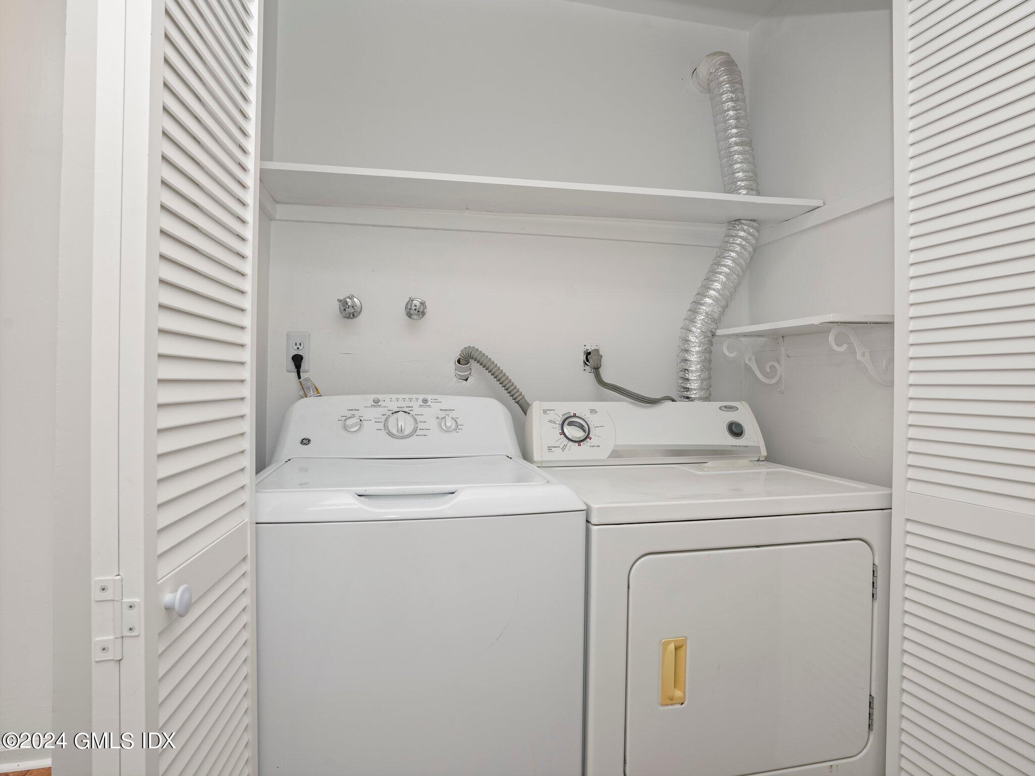 413 Glenbrook Road, Unit 1 Stamford, CT 06906 - Photo 17 of 21 a utility room with dryer and washer