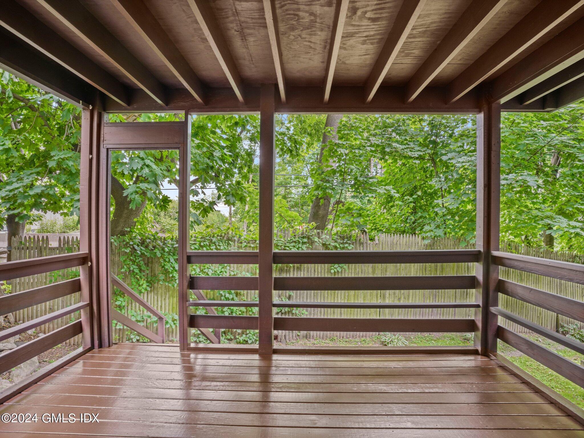 413 Glenbrook Road, Unit 1 Stamford, CT 06906 - Photo 18 of 21 a view of a porch with wooden floor in front of house