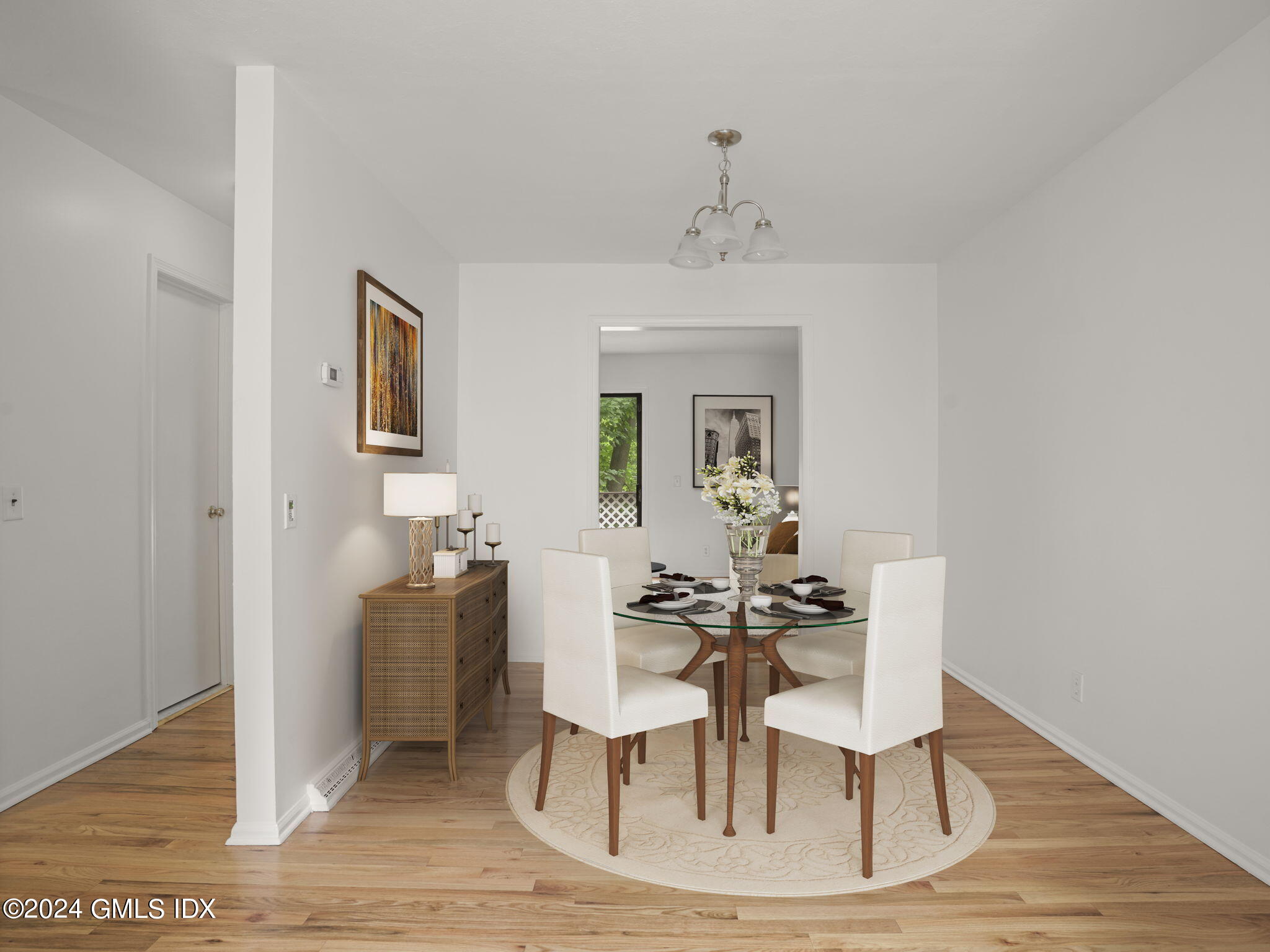 413 Glenbrook Road, Unit 1 Stamford, CT 06906 - Photo 6 of 21 a view of a dining room with furniture and wooden floor