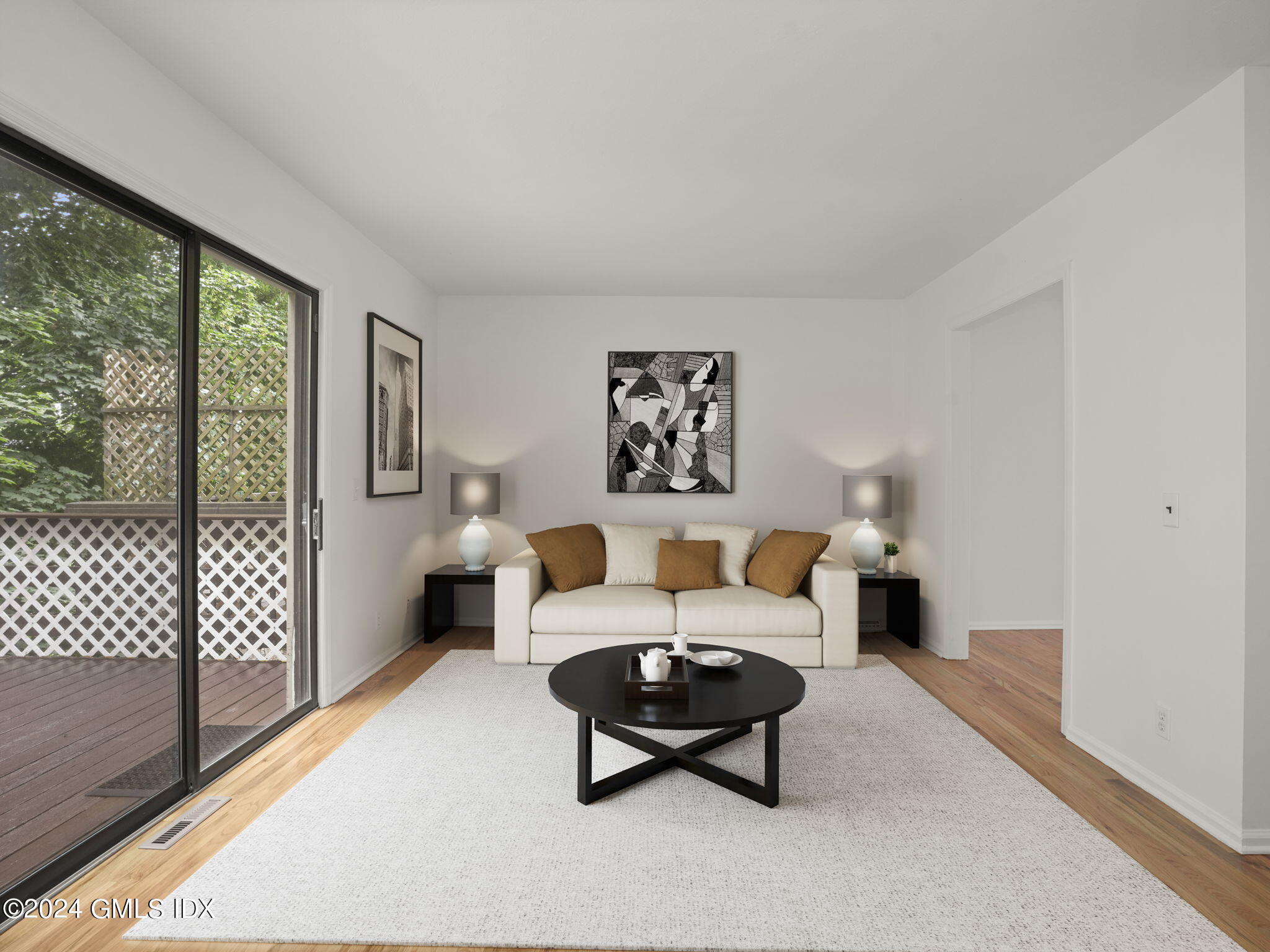 413 Glenbrook Road, Unit 1 Stamford, CT 06906 - Photo 8 of 21 a living room with furniture and a floor to ceiling window