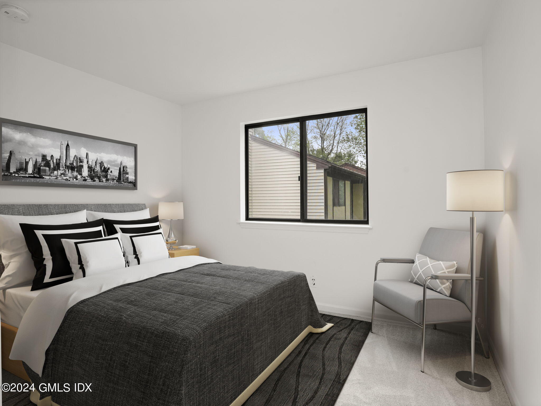 413 Glenbrook Road, Unit 1 Stamford, CT 06906 - Photo 10 of 21 a bedroom with a bed a mirror and a window