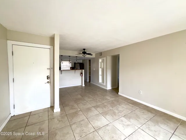 a view of a livingroom with furniture and an entryway