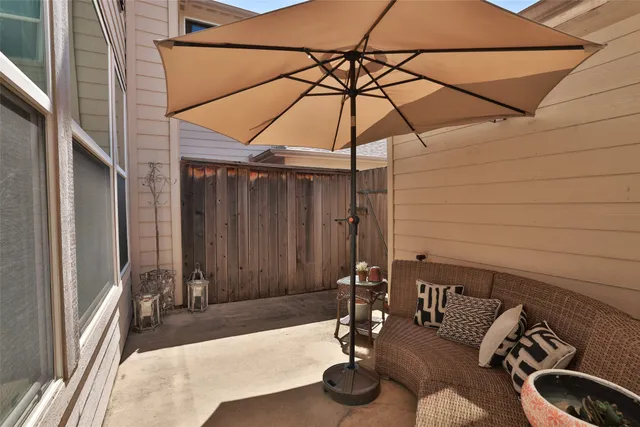 a table and chairs in the balcony