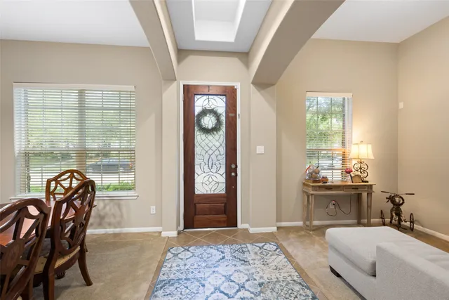 a bedroom with furniture and windows