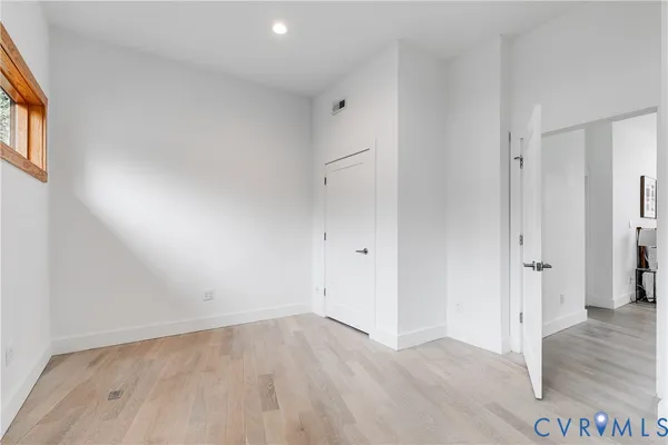 a spacious bathroom with a double vanity sink toilet and shower