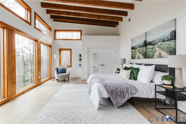 a bedroom with a bed and a couch