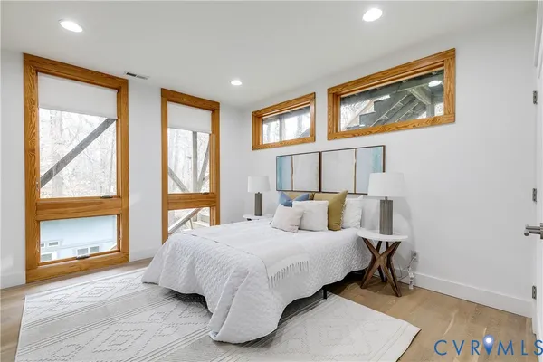 a view of balcony with chairs and wooden fence