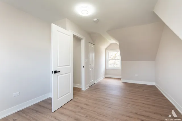 a view of wooden floor and windows in a room