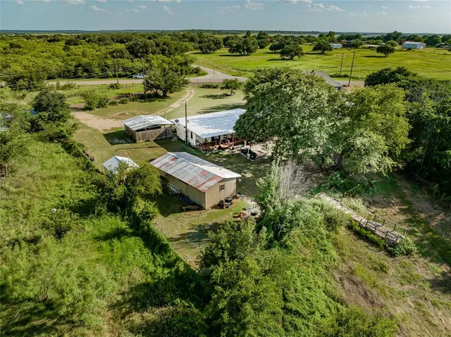 an aerial view of residential house with outdoor space and street view