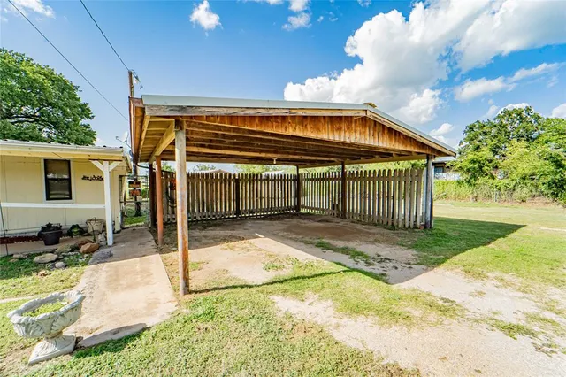 a view of a dining room with furniture and a chandelier