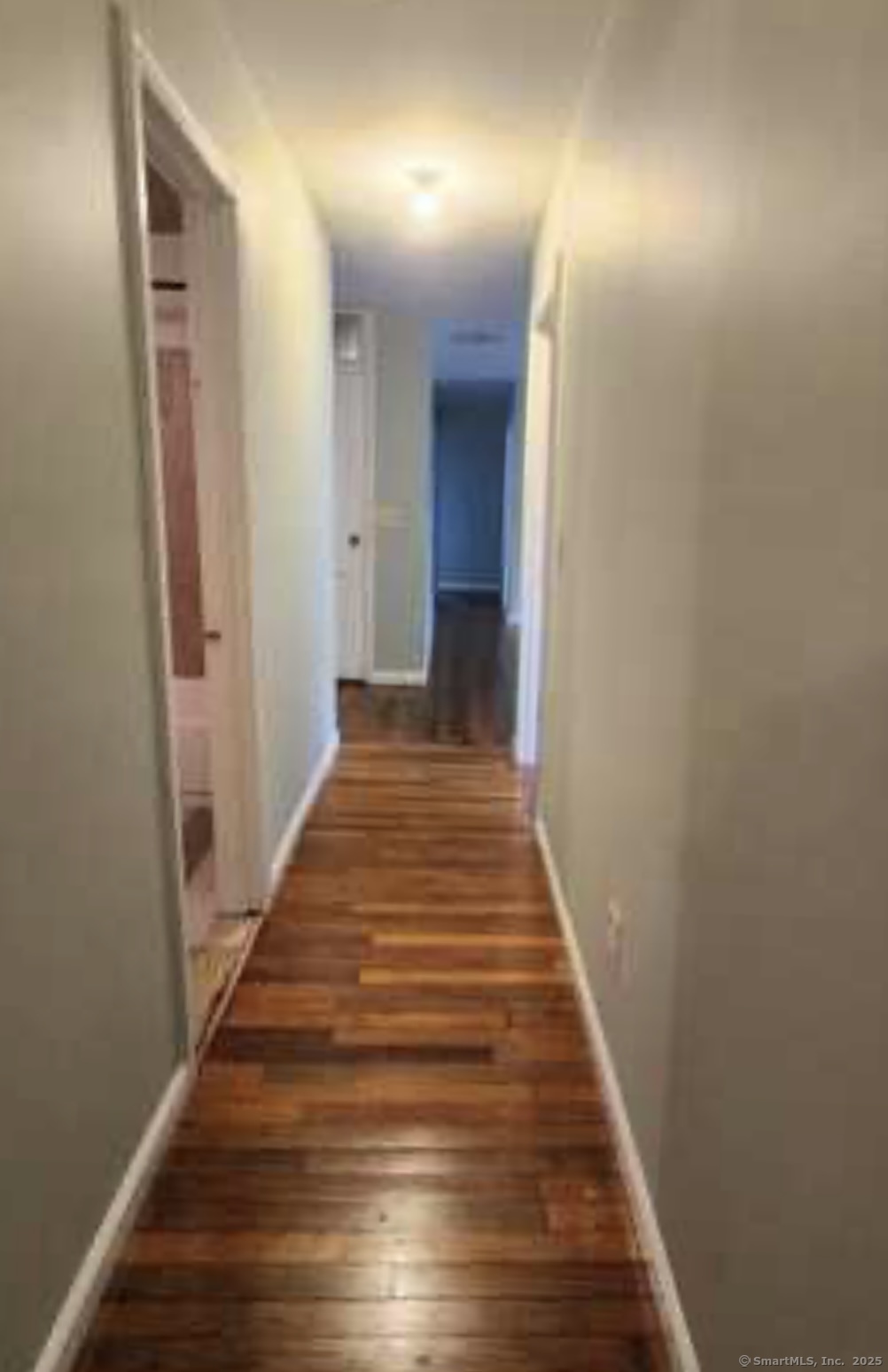 64 James Street Bridgeport, CT 06604 - Photo 6 of 8 a view of a hallway with wooden floor