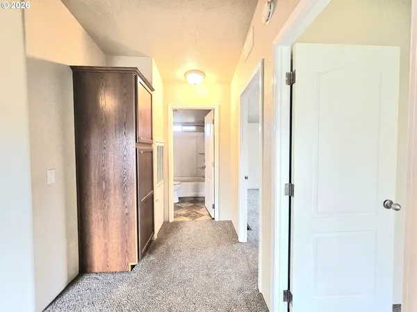 a view of a bathroom from a hallway