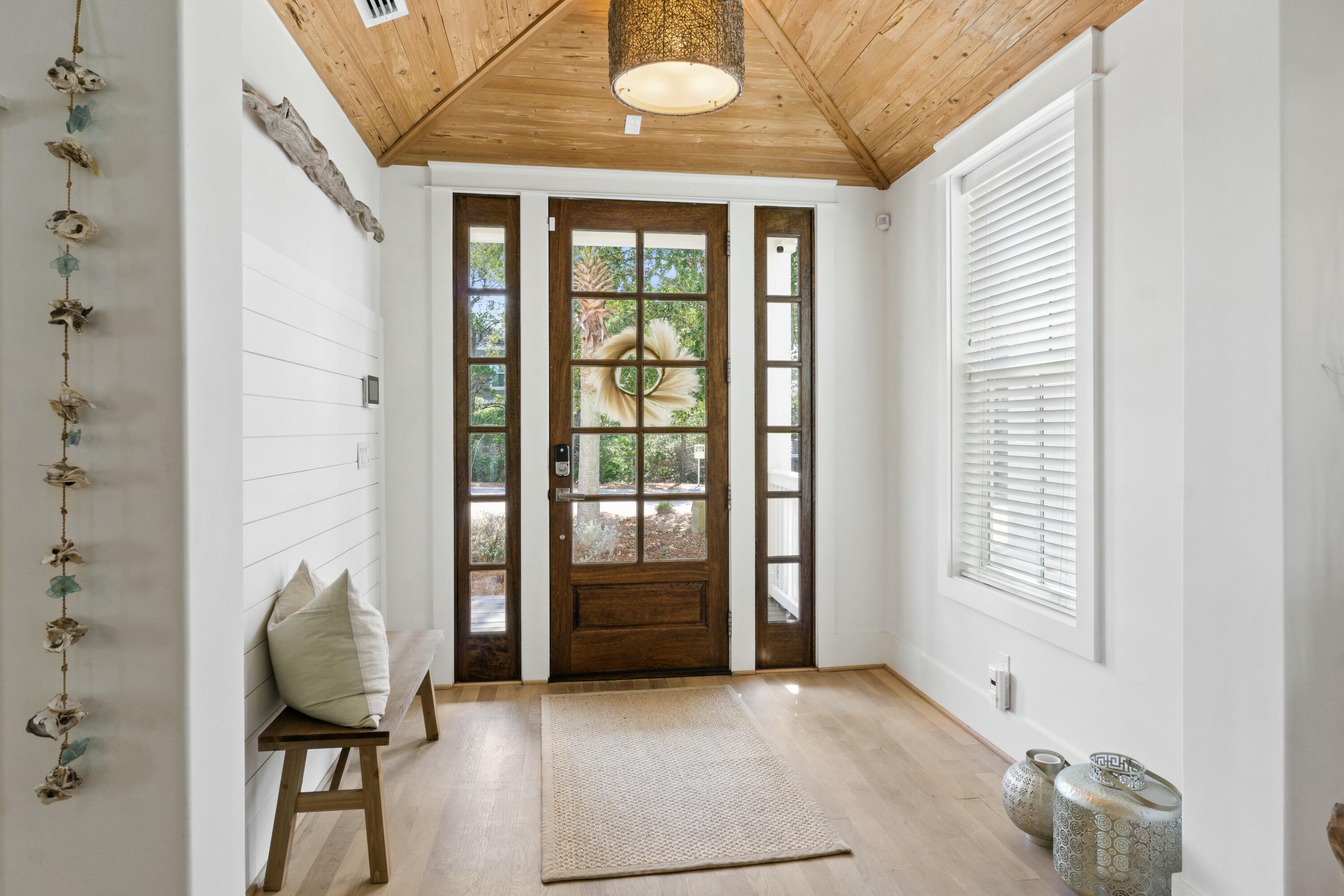 125 Gulfview Circle Santa Rosa Beach, FL 32459 - Photo 16 of 57 a view of a hallway with furniture and a window