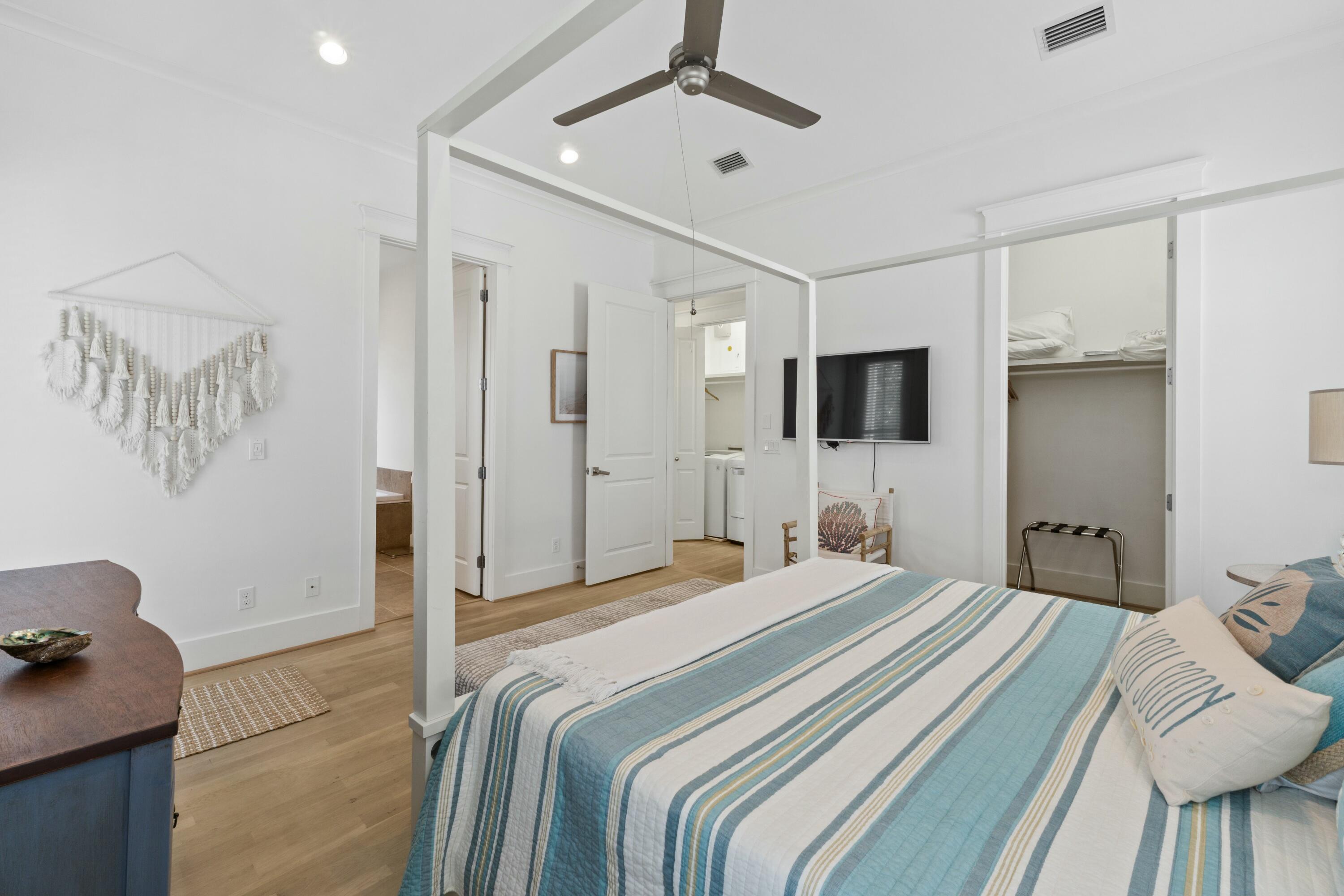 125 Gulfview Circle Santa Rosa Beach, FL 32459 - Photo 23 of 57 a bedroom with a bed window and a flat screen tv