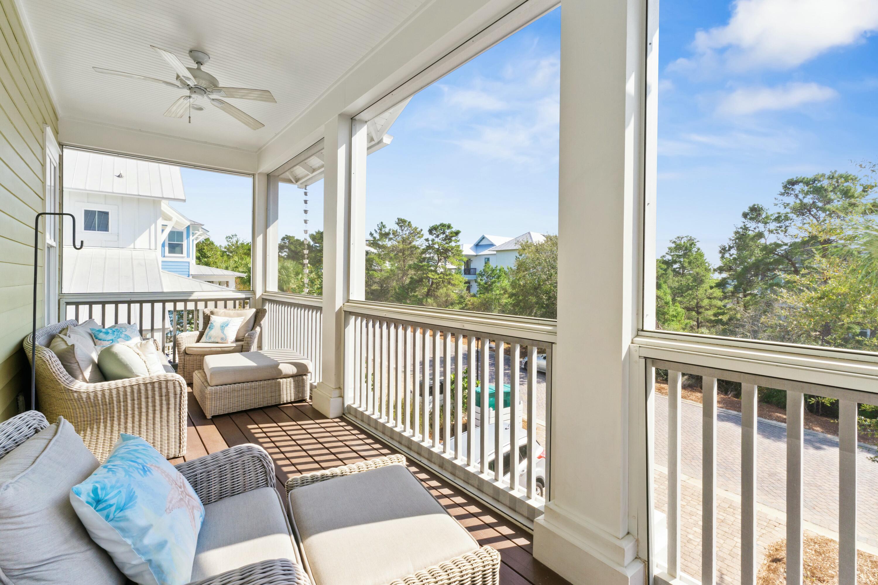 125 Gulfview Circle Santa Rosa Beach, FL 32459 - Photo 26 of 57 a balcony with furniture and a floor to ceiling window
