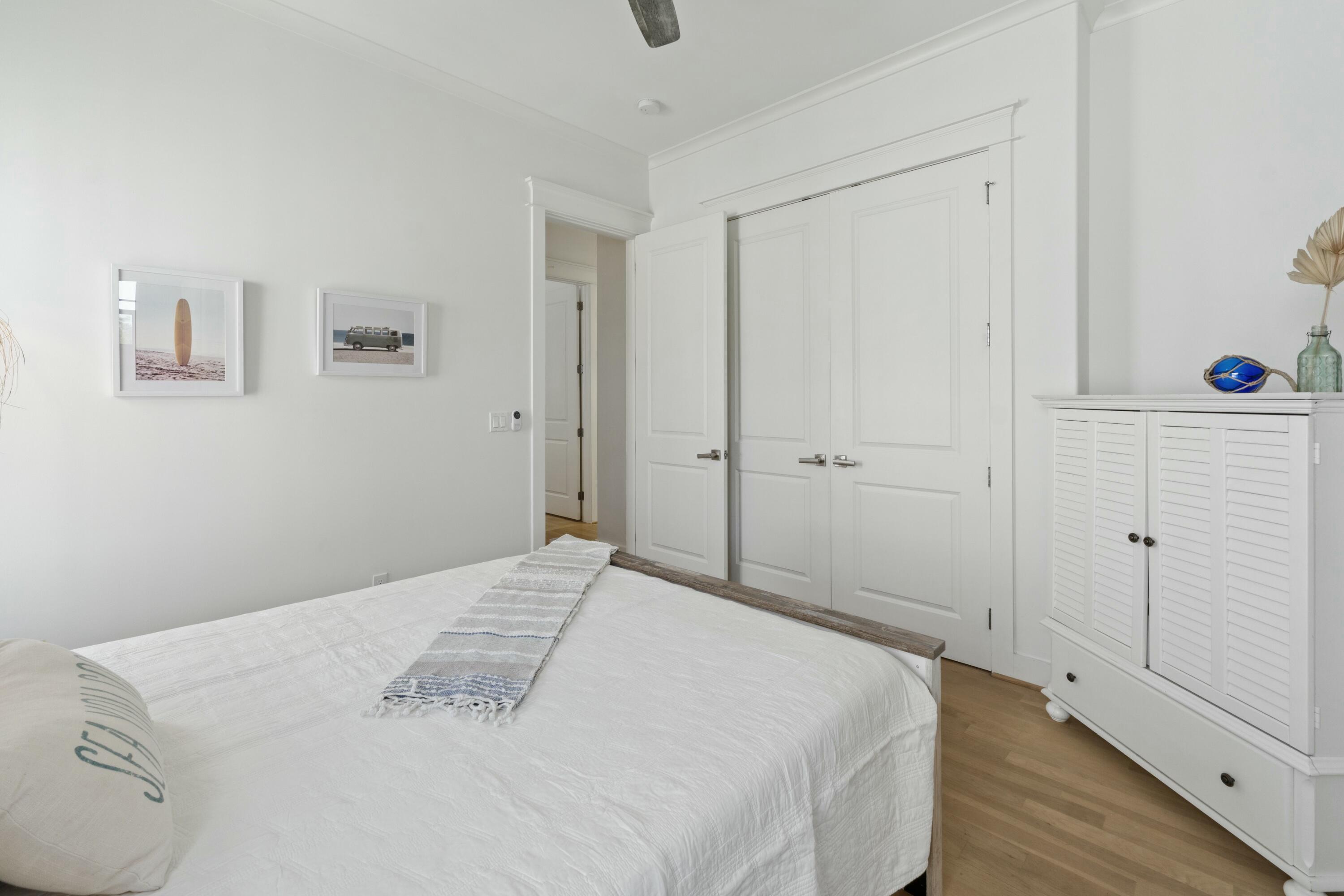 125 Gulfview Circle Santa Rosa Beach, FL 32459 - Photo 36 of 57 a bedroom with a bed and hallway