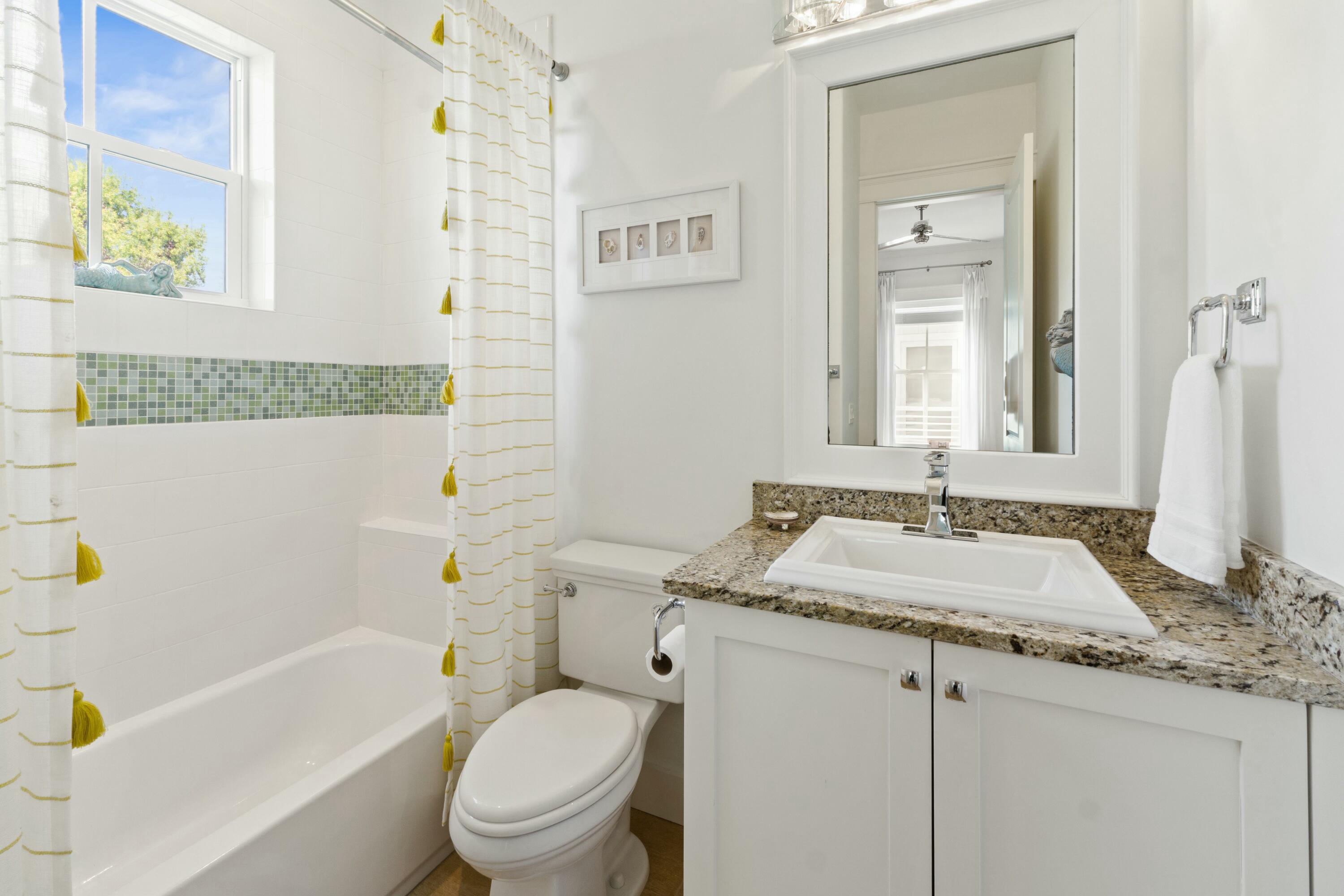 125 Gulfview Circle Santa Rosa Beach, FL 32459 - Photo 44 of 57 a bathroom with a granite countertop sink toilet and shower