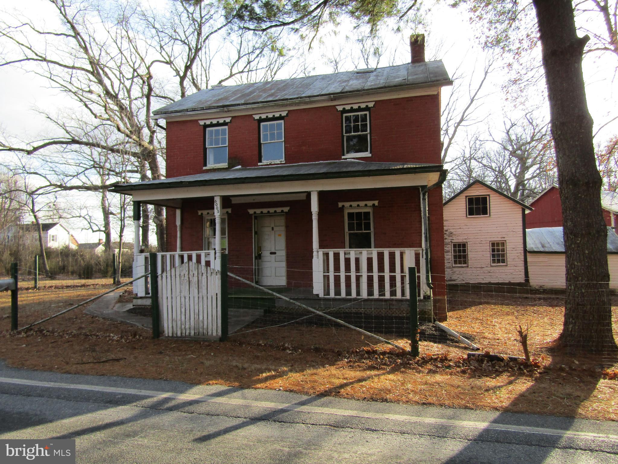 6005 Conover Road Taneytown, MD 21787 - Photo 1 of 30 a front view of a house with a yard