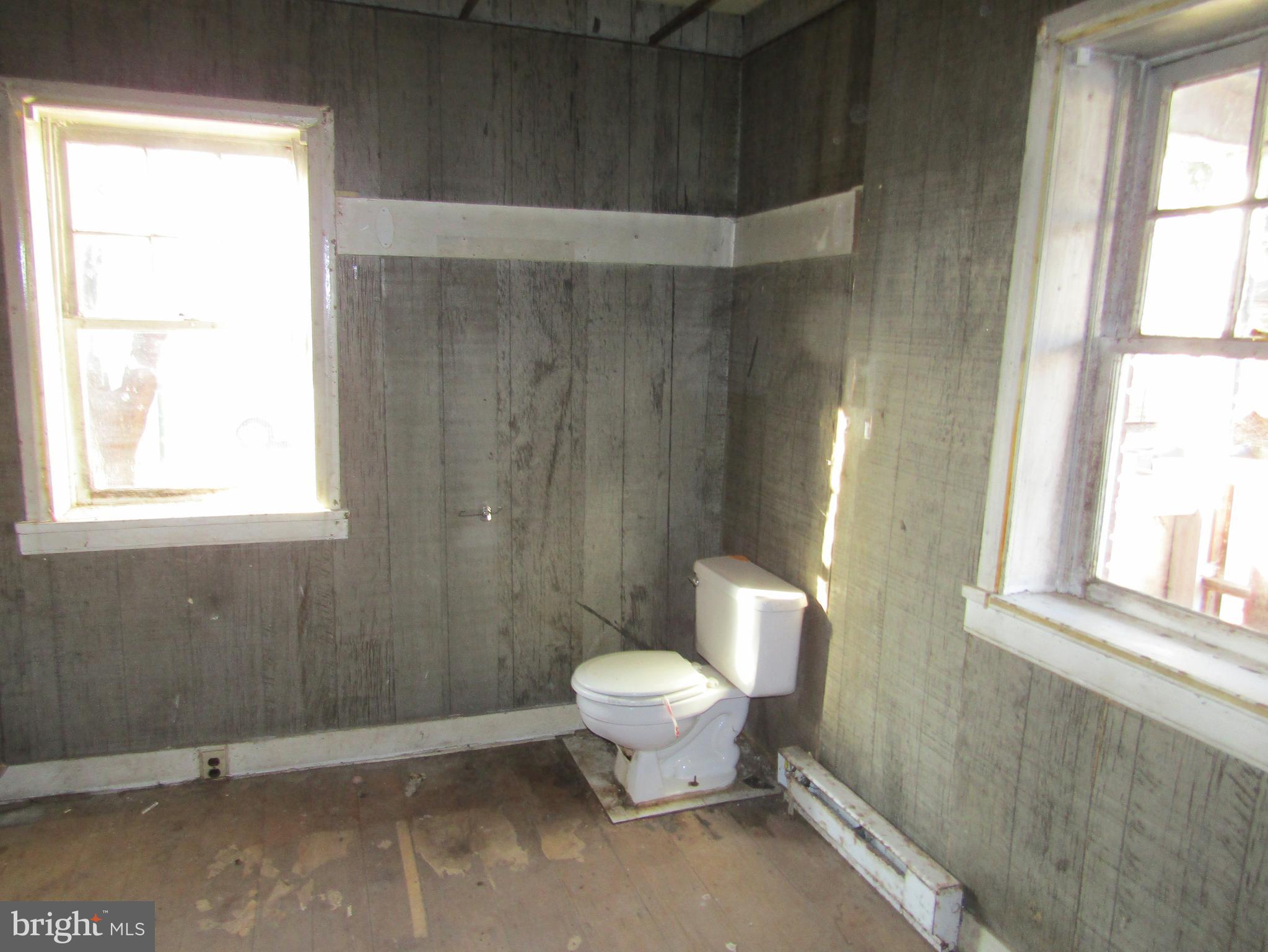 6005 Conover Road Taneytown, MD 21787 - Photo 12 of 30 a bathroom with a toilet sink and a window