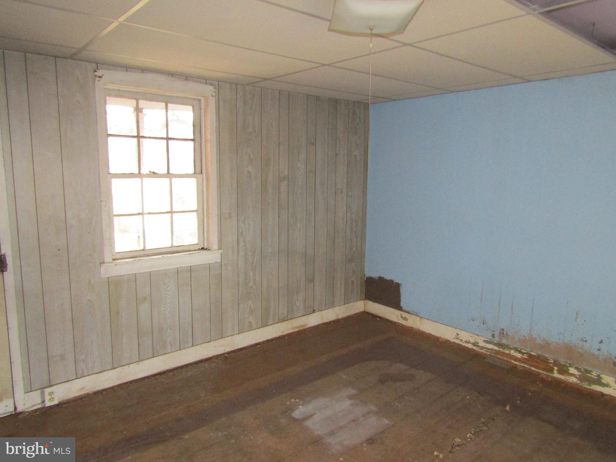 6005 Conover Road Taneytown, MD 21787 - Photo 18 of 30 an empty room with wooden floor and windows