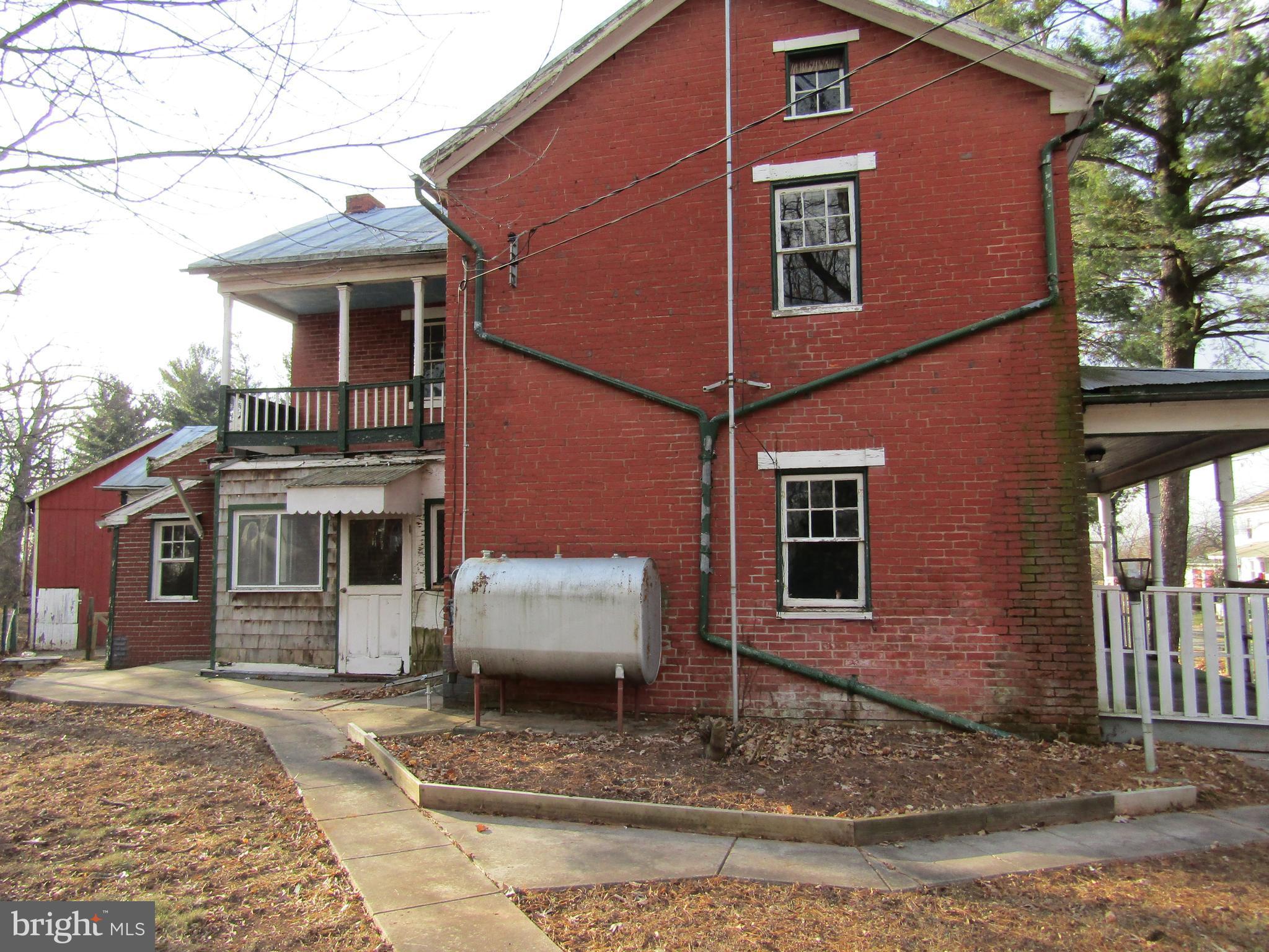 6005 Conover Road Taneytown, MD 21787 - Photo 3 of 30 a view of a house with a patio