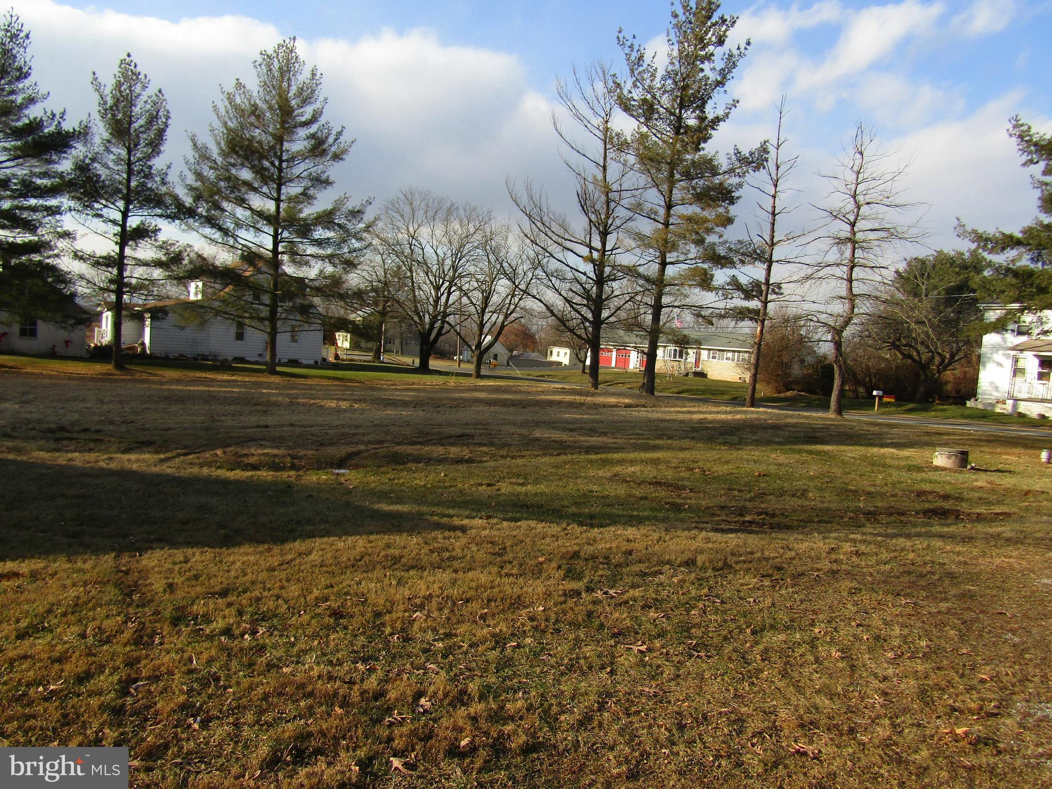 6005 Conover Road Taneytown, MD 21787 - Photo 30 of 30 a backyard of apartments with large trees