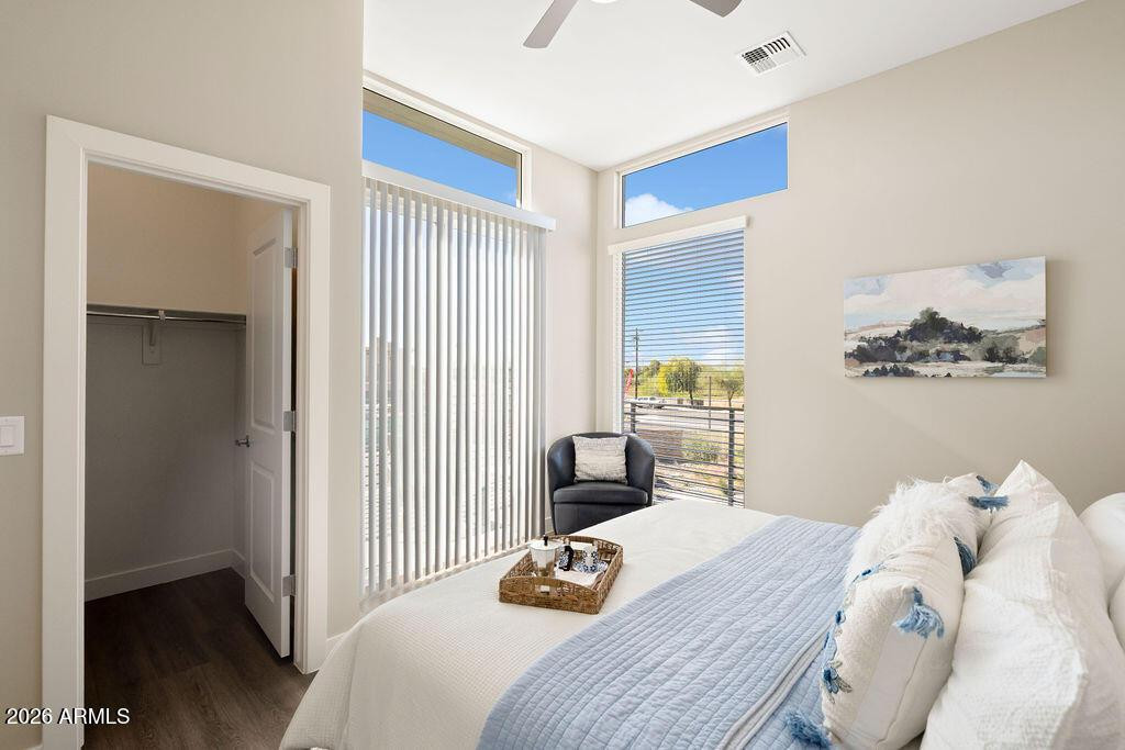 1927 South Recker Road, Unit 154 Mesa, AZ 85206 - Photo 16 of 50 a bedroom with a bed and a window