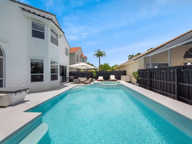 a view of an chairs and table in the balcony