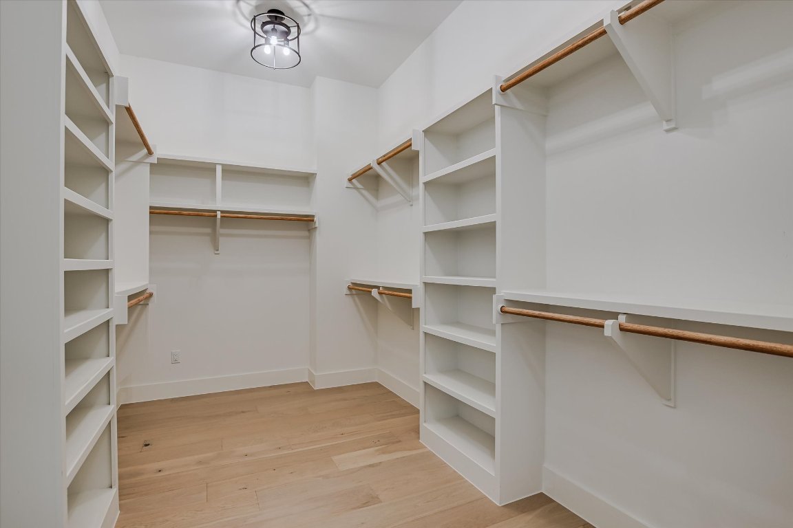 935 Wesley Ridge Drive Spicewood, TX 78669 - Photo 24 of 40 a view of an empty walk in closet