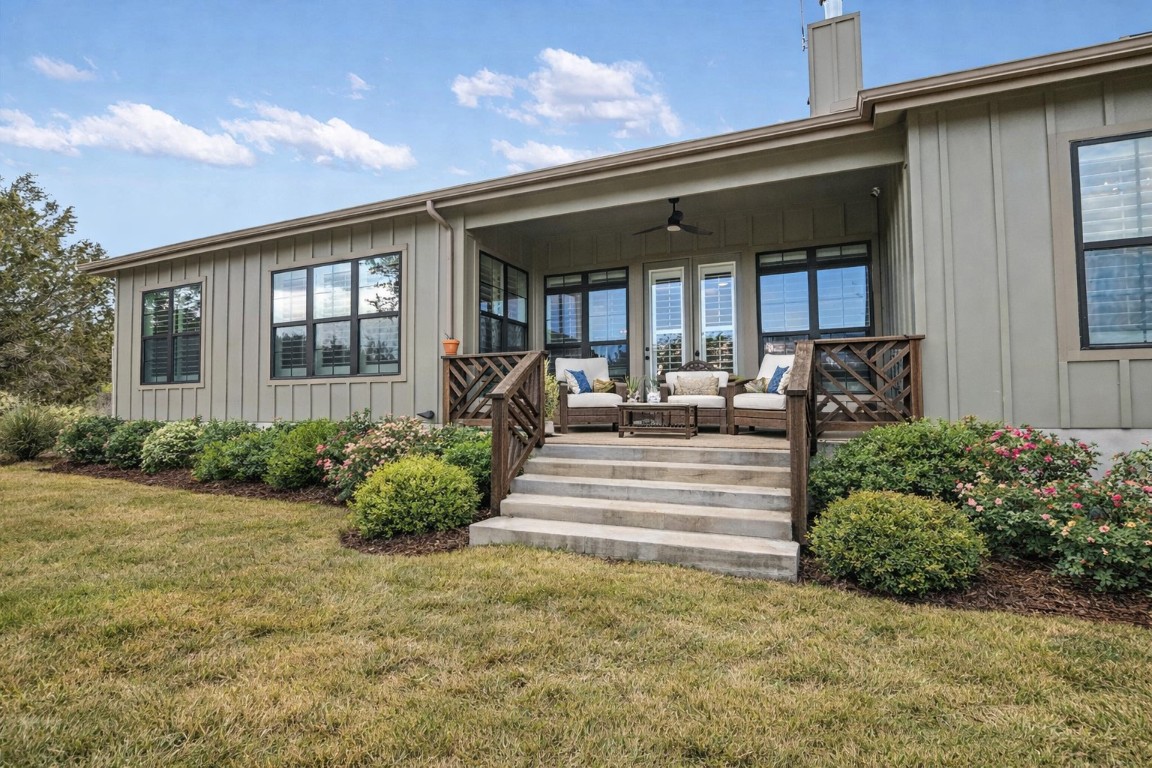 935 Wesley Ridge Drive Spicewood, TX 78669 - Photo 27 of 40 a view of a house with backyard and porch