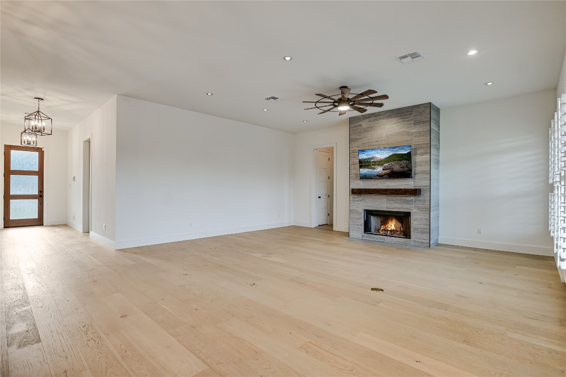 935 Wesley Ridge Drive Spicewood, TX 78669 - Photo 7 of 40 a view of an empty room with a fireplace