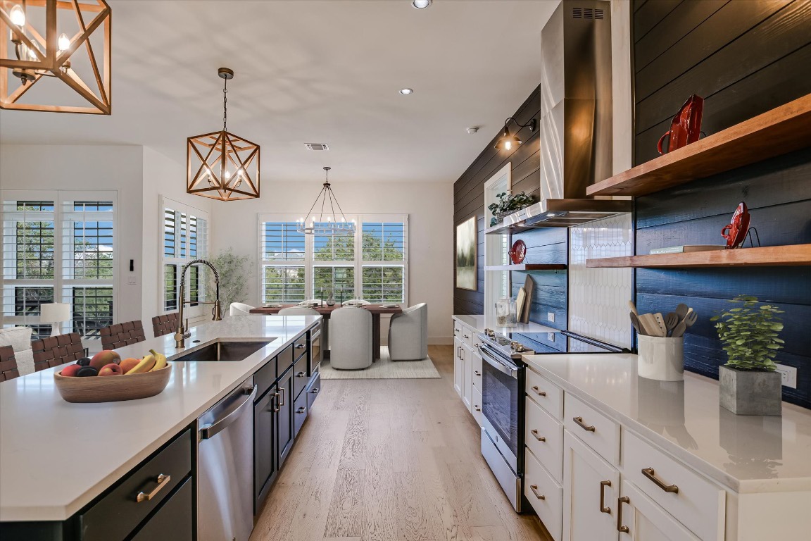 935 Wesley Ridge Drive Spicewood, TX 78669 - Photo 10 of 40 a kitchen with lots of counter top space