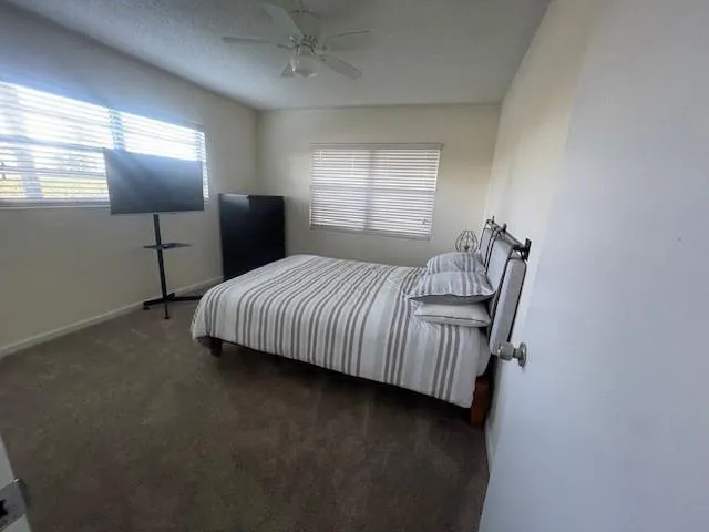 a bedroom with a bed and window