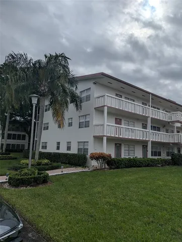 a view of building with yard