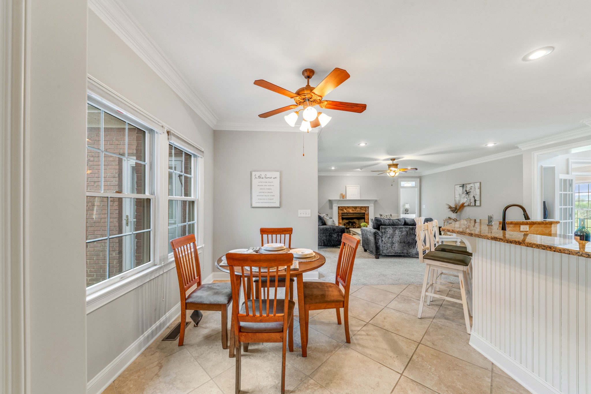 3895 Ostella Road Lewisburg, TN 37091 - Photo 31 of 100 a view of a dining room and livingroom with furniture a floor to ceiling window and a chandelier