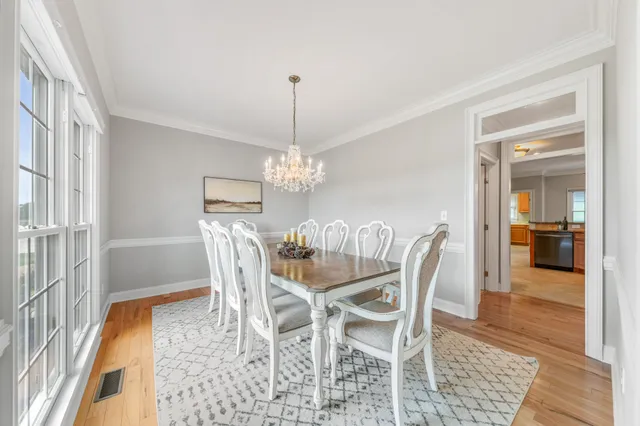 a bed room with a bed and a chandelier