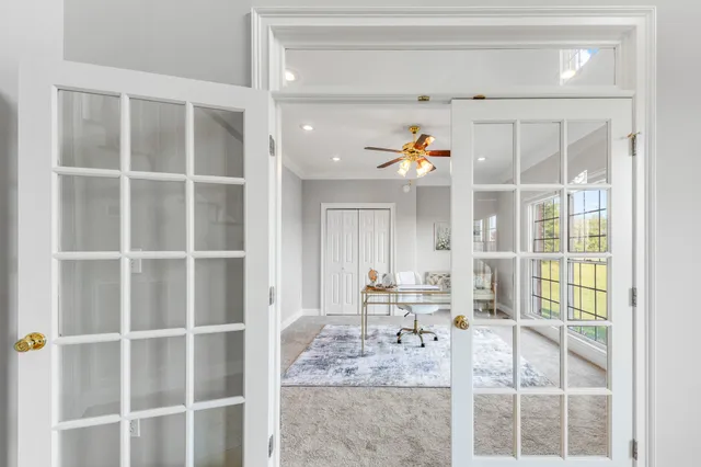 a view of a balcony with two chairs and a table