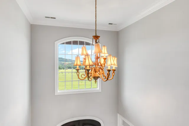 a view of a house with a yard and garage