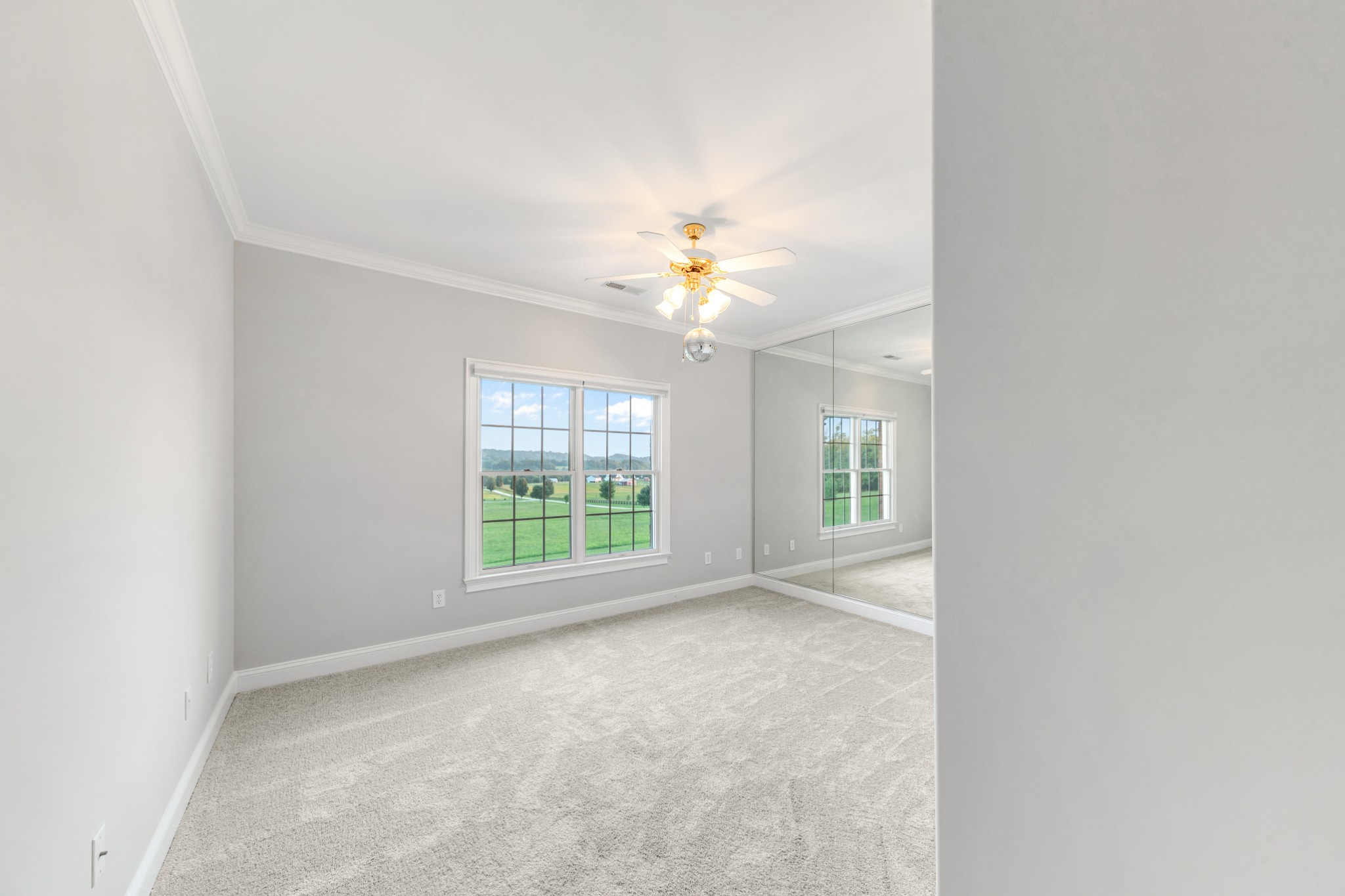 3895 Ostella Road Lewisburg, TN 37091 - Photo 64 of 100 an empty room with windows and chandelier fan