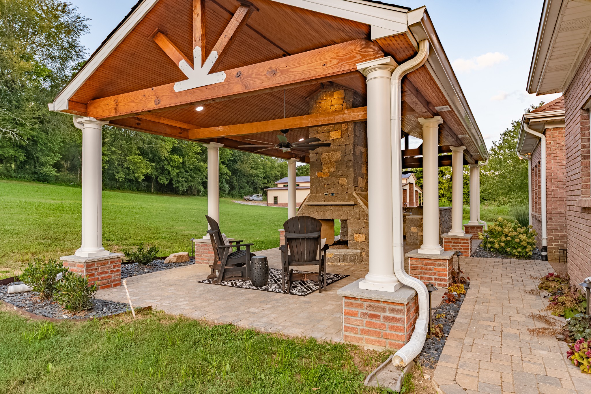 3895 Ostella Road Lewisburg, TN 37091 - Photo 72 of 100 a view of a patio with table and chairs under an umbrella
