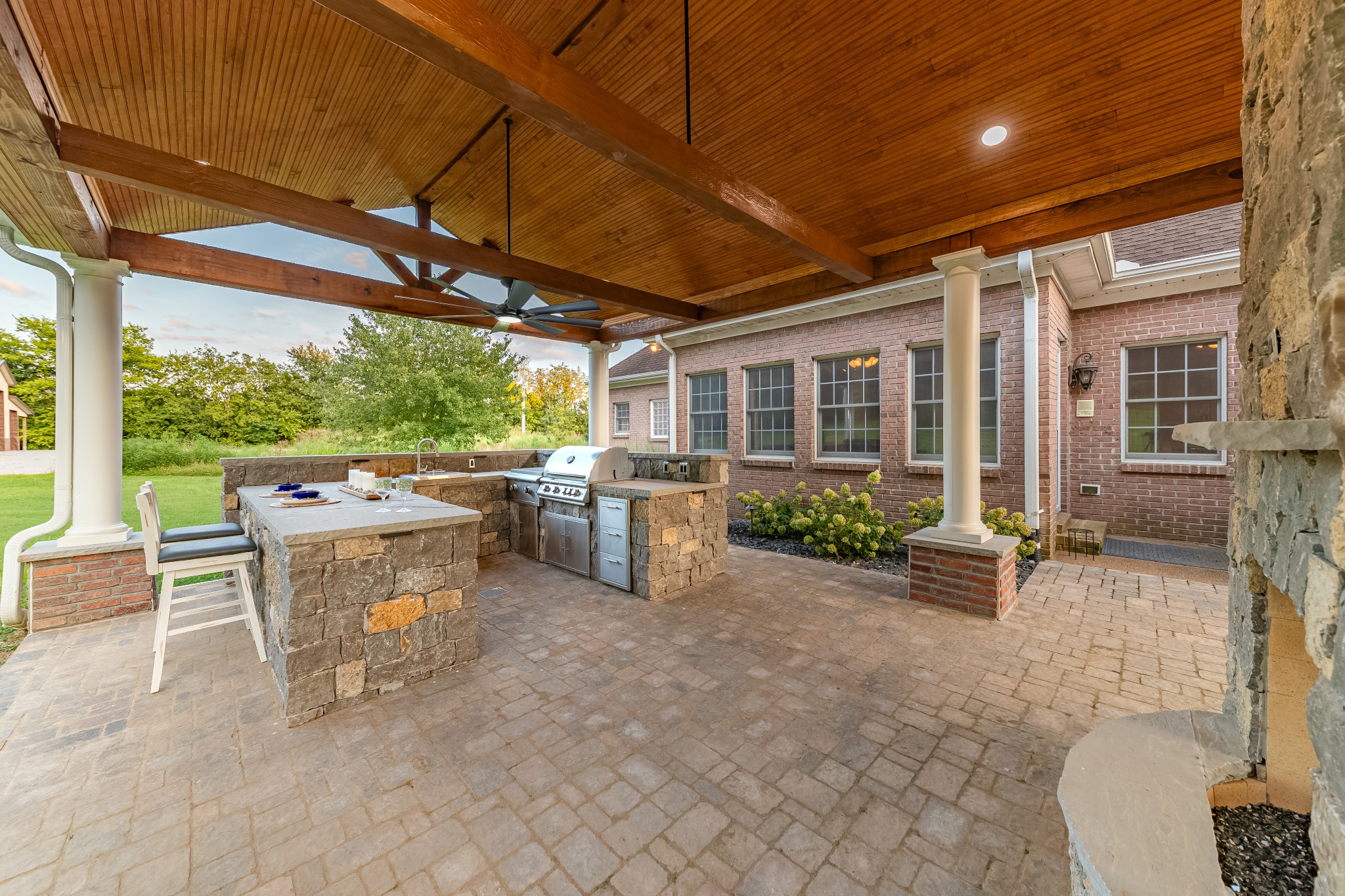 3895 Ostella Road Lewisburg, TN 37091 - Photo 77 of 100 a view of a patio with table and chairs potted plants with wooden fence