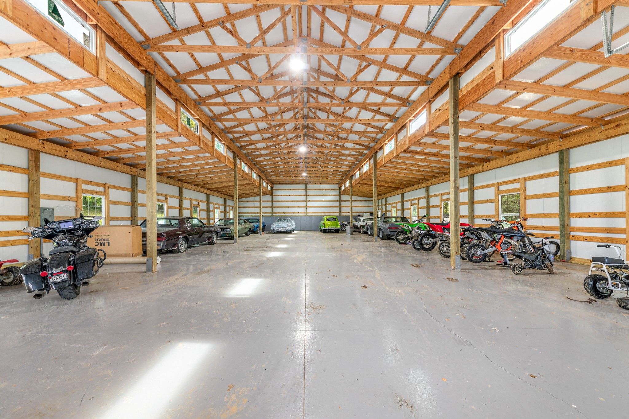 3895 Ostella Road Lewisburg, TN 37091 - Photo 94 of 100 a view of a garage with a bike and wooden roof