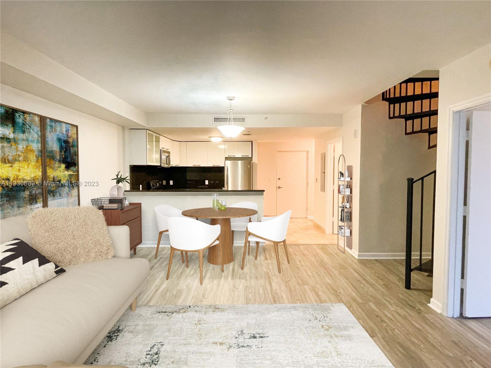 3339 Virginia Street, Unit PH26 Miami, FL 33133 - Photo 4 of 19 a living room with furniture and a wooden floor