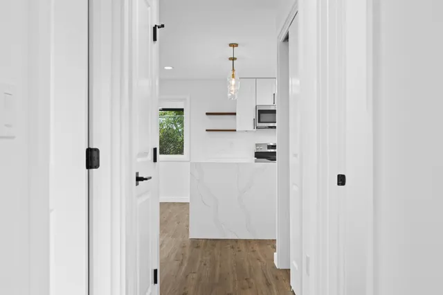 a view of kitchen with wooden floor