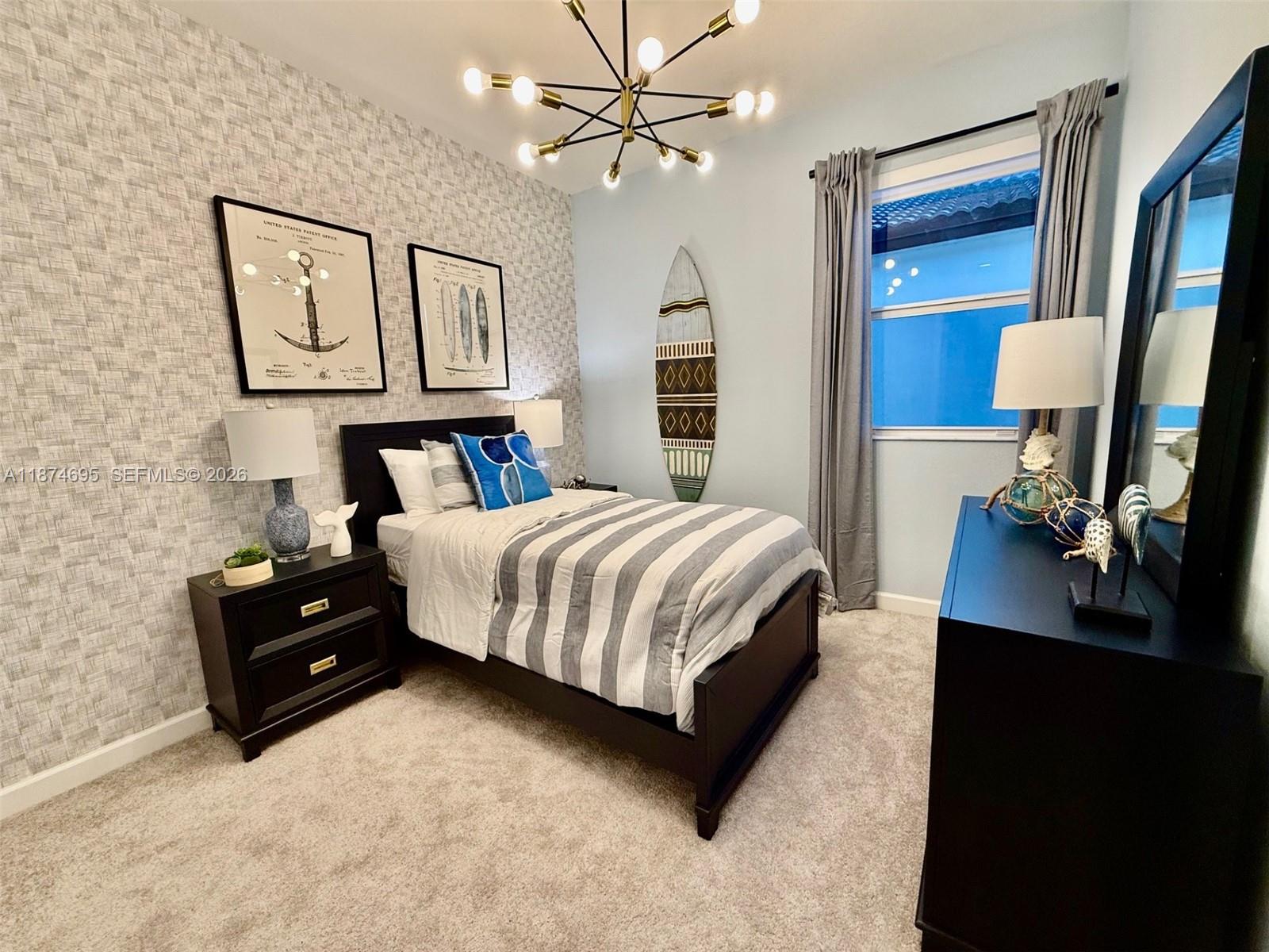 2600 Southeast 25th Street Homestead, FL 33035 - Photo 14 of 61 a bedroom with a bed and dresser with mirror