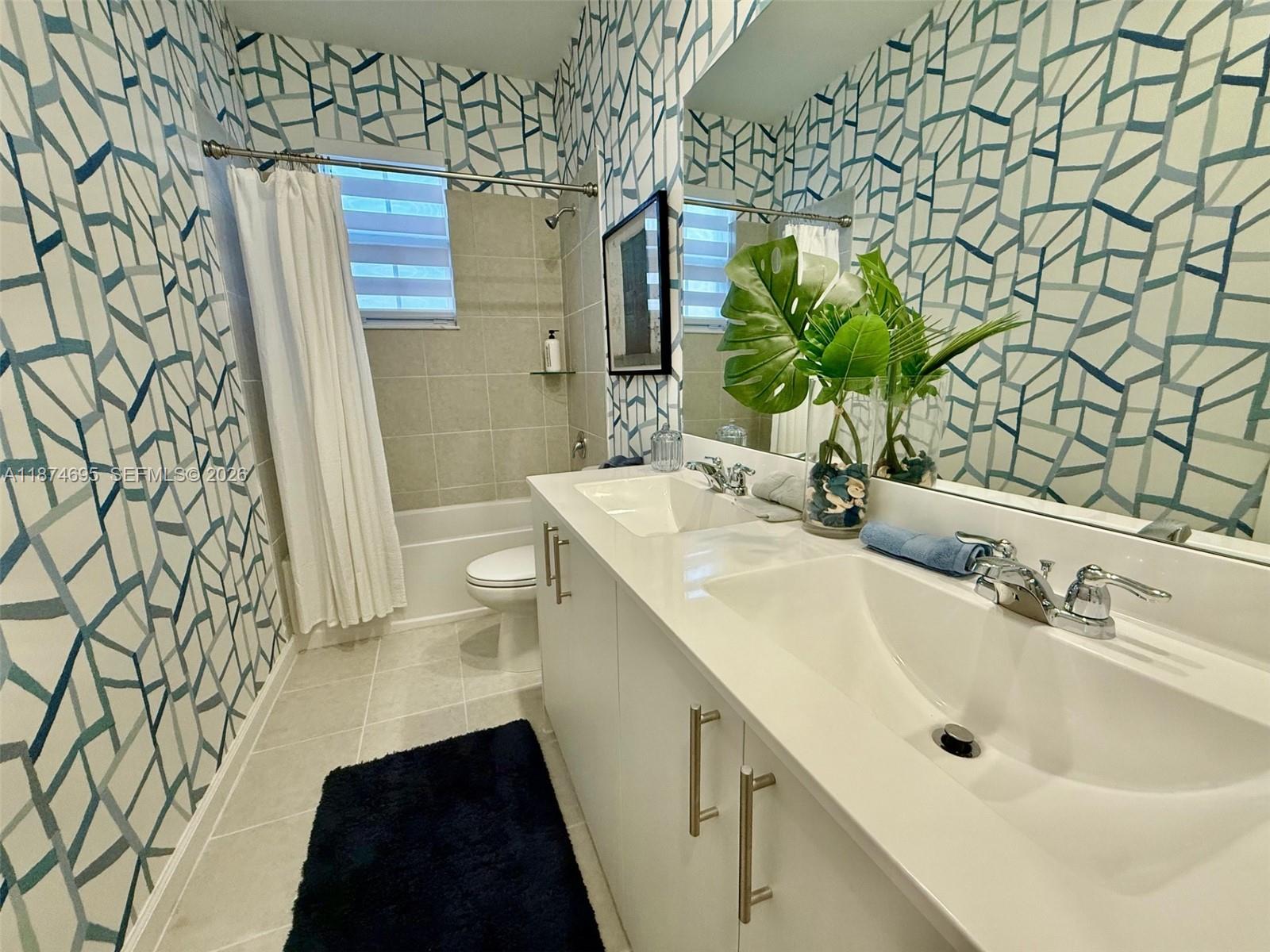 2600 Southeast 25th Street Homestead, FL 33035 - Photo 16 of 61 a bathroom with a sink and a mirror