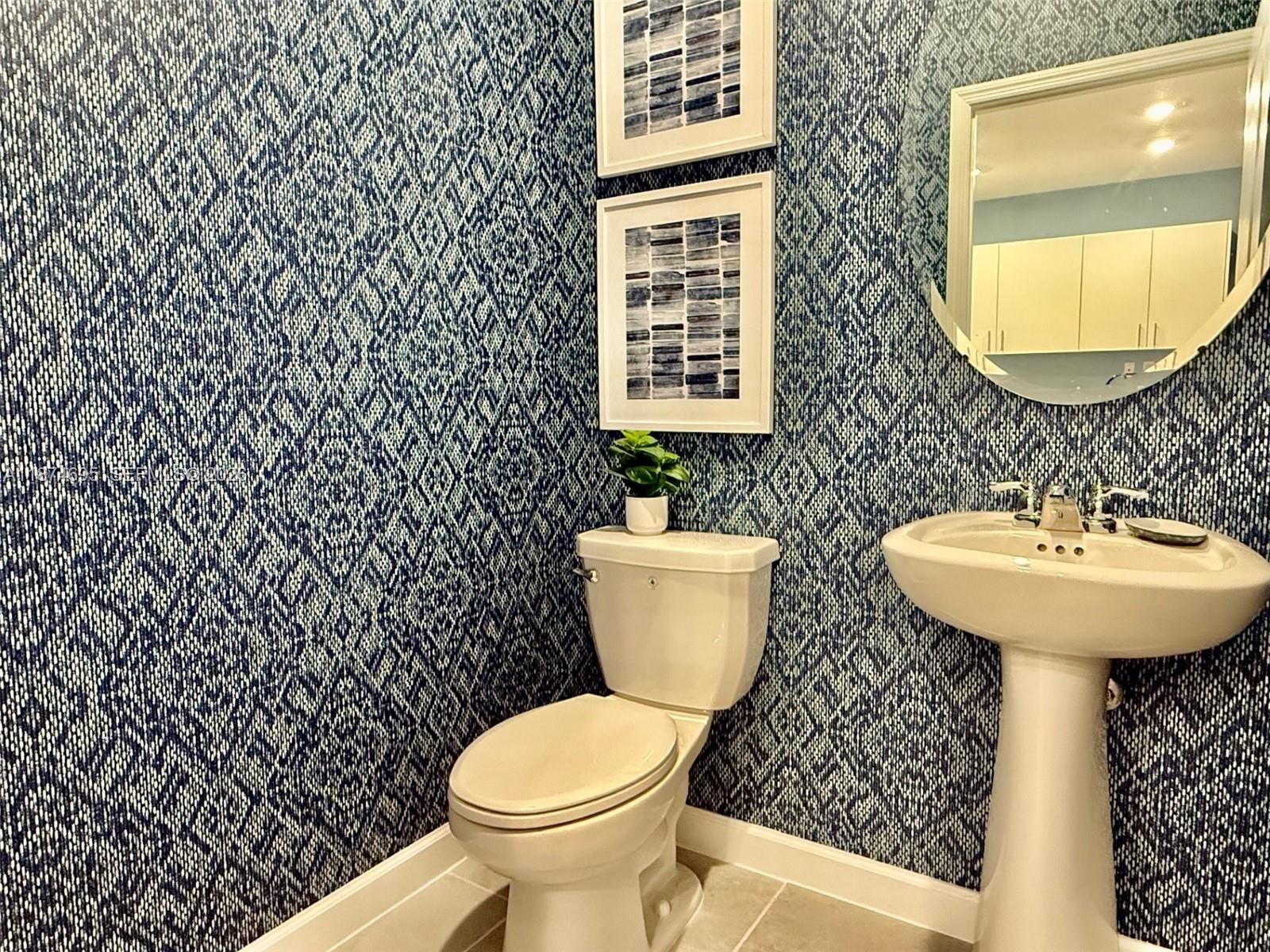 2600 Southeast 25th Street Homestead, FL 33035 - Photo 17 of 61 a bathroom with a sink toilet and a mirror