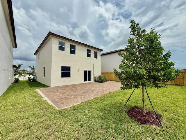 a view of a swimming pool with a yard